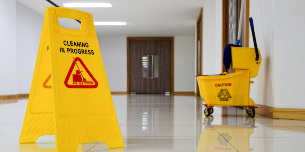 Yellow Warning Sign: Office Commercial Cleaning Services in Progress