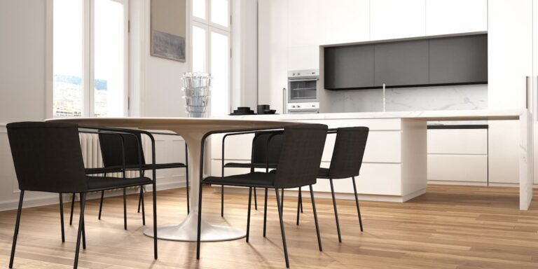 Modern kitchen and dining space with wood style floors showing how to clean Luxury Vinyl flooring for a smooth and well maintained finish.